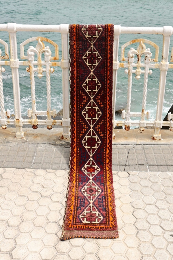 Vintage Baluch rug from Afghanistan. 252x33 cms