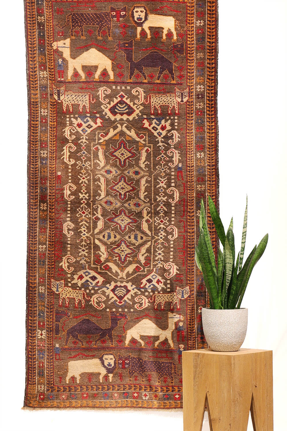 Semi-antique Baluch rug with tigers and lions. 201x91 cms